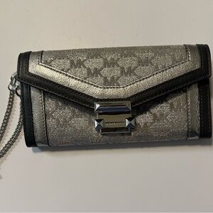 Michael Kors Silver and Black Wristlet with Structured Design